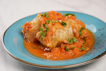 Cabbage rolls with chicken meat and rice in tomato sauce. Stuffed cabbage leaves. Delicious dinner