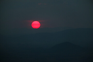 The red sun was rising at the viewing point. View of Khao Yai Thiang, Thailand