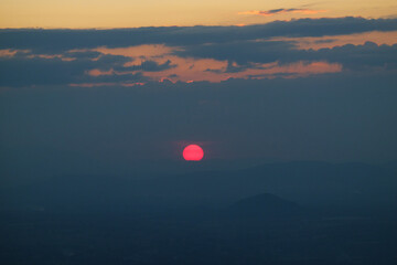 The red sun was rising at the viewing point. View of Khao Yai Thiang, Thailand