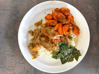 Malaysian styled complete meal for lunch or dinner called Nasi Campur.  It is plain white rice served with variety of dishes.