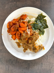 Malaysian styled complete meal for lunch or dinner called Nasi Campur.  It is plain white rice served with variety of dishes.