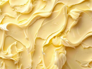 Close-up of creamy, smooth, and rich butter texture. Photographed from above.  Perfect for food backgrounds.