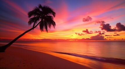Obraz premium Serene Sunset Beach with Palm Tree Silhouette.