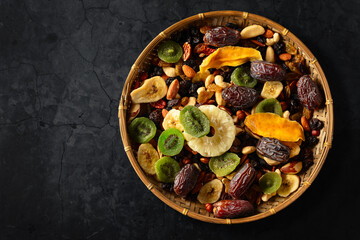 Dried tropical fruits with various nuts and raisins.