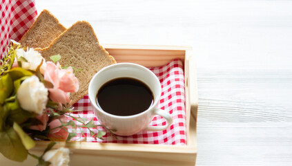 Glass cup with coffee and served with toasted bread  background Simple breakfast.