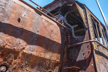 Steam locomotive in very bad condition, completely rusty and abandoned on the unused tracks at Uşak Rail way station.