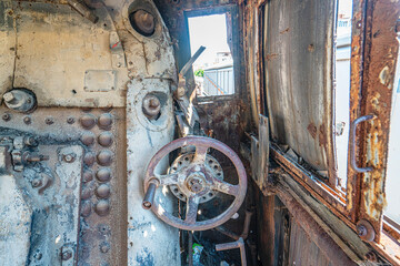 Steam locomotive in very bad condition, completely rusty and abandoned on the unused tracks at Uşak Rail way station.
