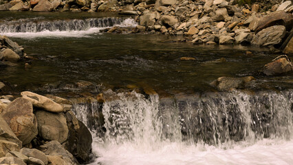 Texture of a falling water of a waterfall in a river