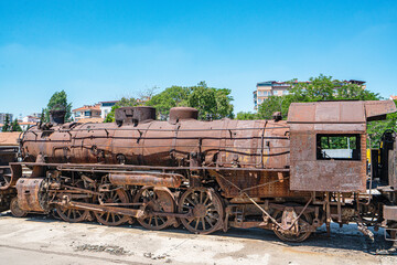 Steam locomotive in very bad condition, completely rusty and abandoned on the unused tracks at Uşak Rail way station.