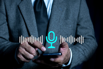 Man touching microphone icon on smart phone. Use your voice to direct AI to search for information on Internet. application record sound, audio, music, voice message.