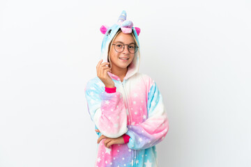 Little girl with unicorn pajamas isolated on white background with glasses and happy