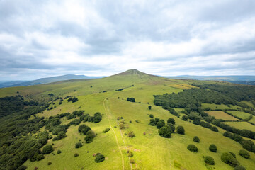 epic aerial view of the Sugar Loaf, mountain peak, Abergavenny, Monmouthshire Wales, United Kingdom