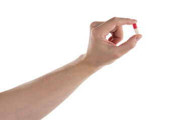 Male hand show red and white pills isolated on white