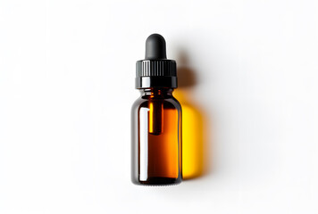 Naklejka premium Amber glass dropper bottle with black cap isolated on white background