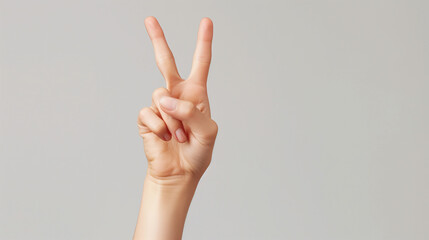 Woman hand showing Win sign isolated, two fingers up