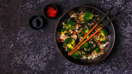 Cooking asian stir fry rice with vegetables