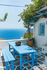 Fototapeta premium Whitewashed Patio With Ocean View and Wooden Table