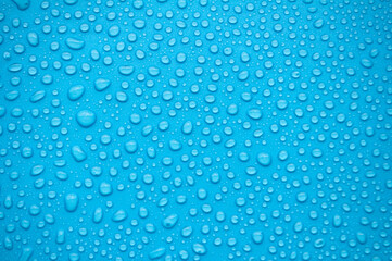 Close up of water droplets on blue background