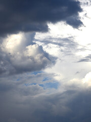 Cumulus clouds. White clouds on the blue sky close-up.