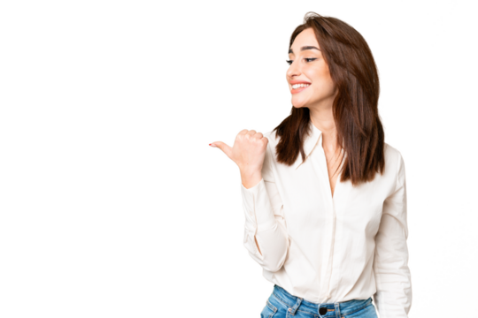 Young caucasian woman over isolated chroma key background pointing to the side to present a product