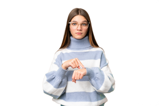 Teenager girl over isolated chroma key background making the gesture of being late