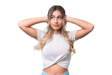 Young Uruguayan woman over isolated background frustrated and covering ears
