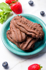 Chocolate shortbread cookies. Light background