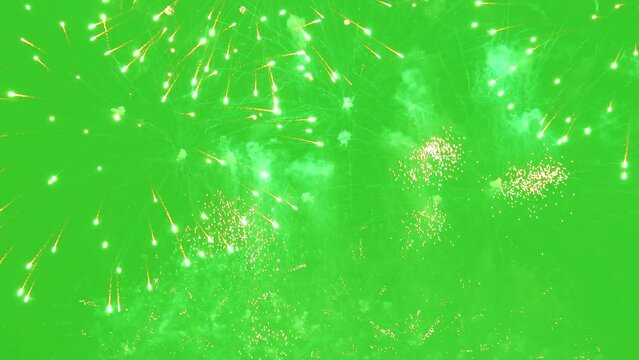 Bright lightning firework display during the festival celebration on green screen background
