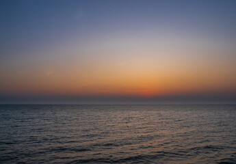 Sunset sea vertical high view landscape horizon beautiful summer season shore nobody wind soft wave cool holiday look calm sky twilight evening day time nature tropical coast ocean water travel