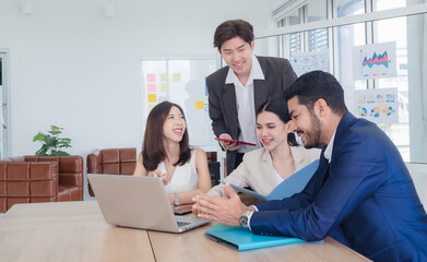 Portrait business team woman and man asian group meeting sit look holding document and look computer talking new project creative write note plan ready for happy working online sale inside room office