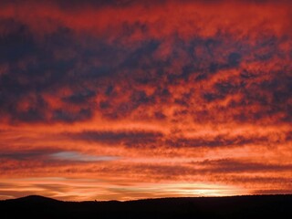   a striking sunset over the savannah at maasai mara national game reserve in narok, kenya, east africa      