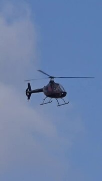 Helicopter flying towards the camera at regional airfield airport