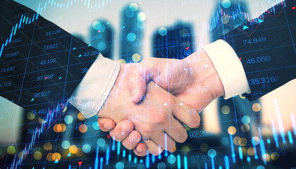 Two individuals shaking hands with a double exposure of financial charts, representing a business agreement with a creative overlay concept on a bokeh and numerical background