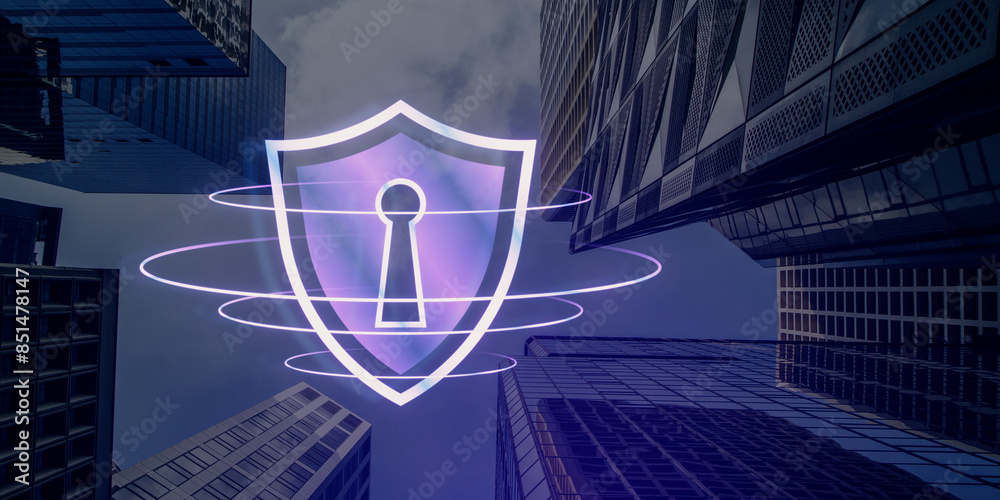 Poster A hologram of a shield with a keyhole displayed between skyscrapers, suggesting digital security concept on an urban background