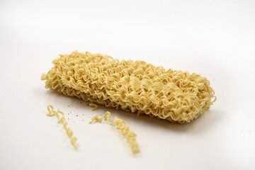 dry noodles, egg noodles, isolated on a white background
