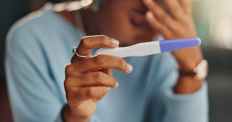 Hands, stress and woman with pregnancy test in home for infertility, bad news or ovulation planning. Sad, upset and closeup of female person reading negative medical information on maternity stick. © WesSide/peopleimages.com