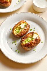 Baked filled potatoes with butter and green onion