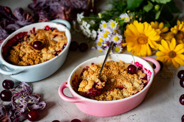 Dessert for breakfast: cherry crumble in a beautiful shape. Cherry pie. Close-up