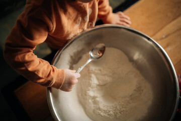 little boy making pizza 