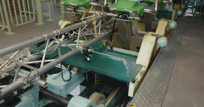 A movie camera mounted on a roller coaster cart.