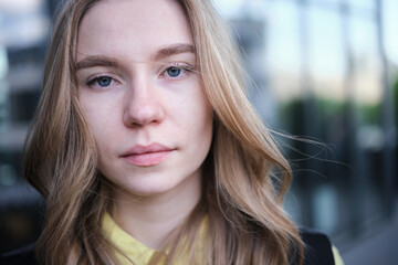 Obraz premium Portrait of a attractive young positive adult female on the business background. Student, business woman, services. High quality photo