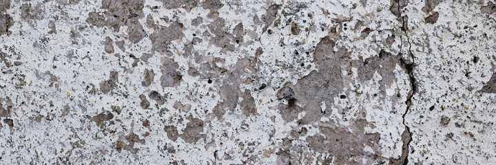 Texture of old cracked concrete wall. Rough gray concrete surface. Wide panoramic background for design.