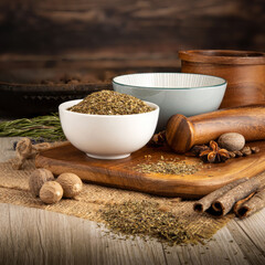 BASIL DRIED HERB on wooden table background. Herbs, spices and dried food baking ingredient. Mortar and different spices. Cottage kitchen. Product Photography