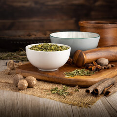 FENUGREEK LEAVES - METHI on wooden table background. Herbs, spices and dried food baking ingredient. Mortar and different spices. Cottage kitchen. Product Photography