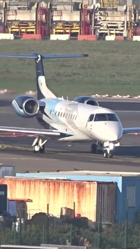 Business Jet Taxiing head on at international airport 