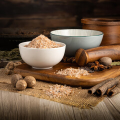 SALT ALPINE MOUNTAIN on wooden table background. Herbs, spices and dried food baking ingredient. Mortar and different spices. Cottage kitchen. Product Photography