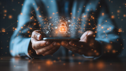 A person is holding a cell phone with a security lock on it