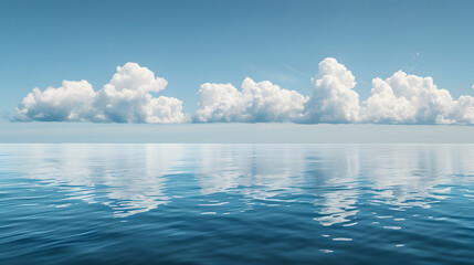 Gentle clouds floating over a calm sea.


