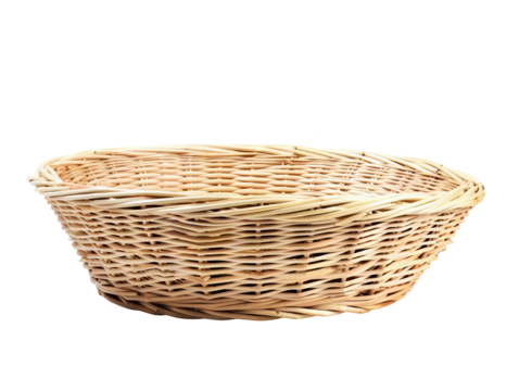 A basket made of straw sits on a white background