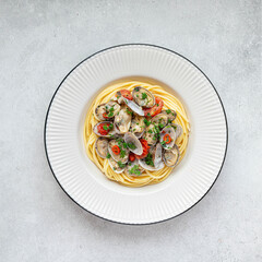 Spaghetti with clams, white wine, garlic and parsley, top view